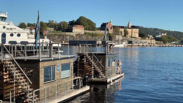 Floating public sauna huts at Aker Brygge in Oslo harbor, Norway	