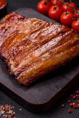 Grilled or barbecued pork or beef ribs with sauce. Cooked or smoked ribs