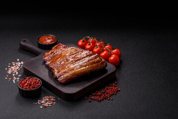 Grilled or barbecued pork or beef ribs with sauce. Cooked or smoked ribs