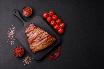 Grilled or barbecued pork or beef ribs with sauce. Cooked or smoked ribs