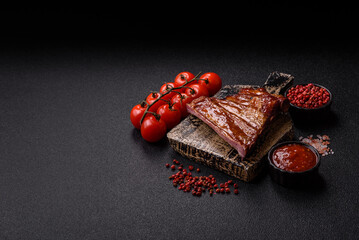 Grilled or barbecued pork or beef ribs with sauce. Cooked or smoked ribs