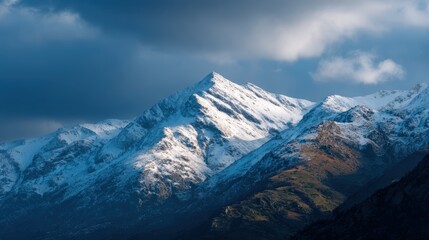 Fototapeta premium Travel landscape photo of snowy mountains with dramatic sky, high-resolution nature textures