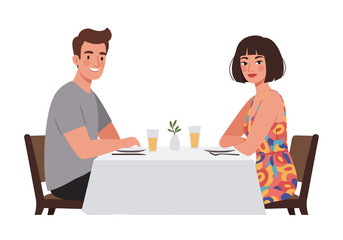 A couple sit at a table with drinks plates and a small floral centerpiece The woman wears a patterned dress