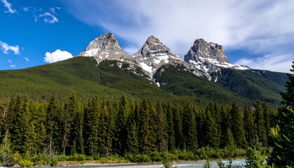Mountain peaks pierce a vibrant blue sky
