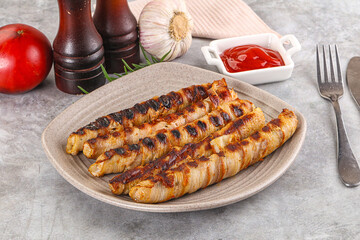 Grilled meat sausages wrapped bacon