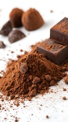 Delectable Dark Chocolate Delights A Tempting Display of Truffles Chocolate Squares and Rich Cocoa Powder on a White Surface