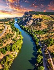 Obraz premium River valley at sunset