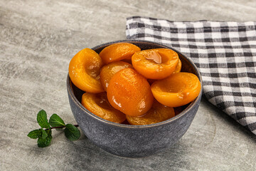 Sweet canned apricots with syrope