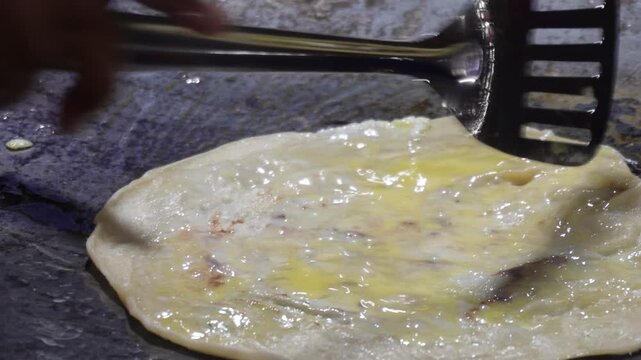 Kolkata egg rolls or egg kati rolls being prepared
