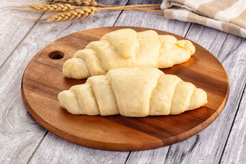 Raw uncooked croissant for bake