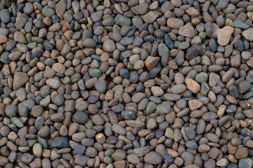 Pebbles stone background texture close up