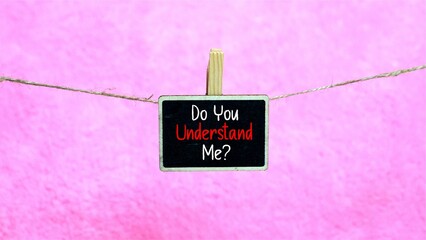 DO YOU UNDERSTAND ME? written on a mini chalkboard with a light pink background.