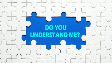 DO YOU UNDERSTAND ME? written in the middle of the puzzle isolated on a blue background.
