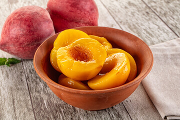 Sweet ripe yellow canned peaches