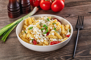 Italian pasta fusili with curd