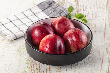 Ripe sweet juicy nectarines heap