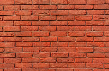 Close-up view of red brick wall featuring various textures and color tones, craftsmanship and strength of traditional masonry work, background with copy space