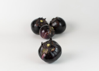 Round eggplant on a white background