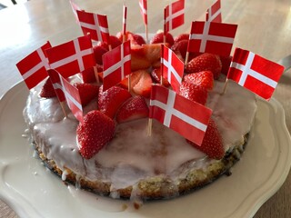 birthday cake with strawberries and flags