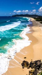 Beach scene with turquoise waves and sandy shore