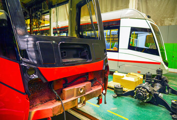 Public transport service. Tram Manufacturing Workshop of  factory plant. Passenger rail tram production. Railway passenger electric tram repair. Public electric bus assembly line. Tram production line