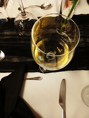 glass of white wine on the table