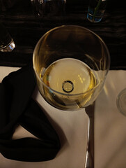 glass of white wine on the table