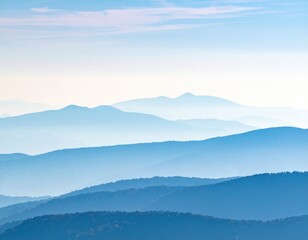 Obraz premium Blue layered mountain range landscape in morning fog.