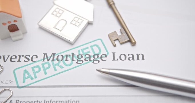 Reverse mortgage form with APPROVED stamp, representing senior housing credit, retirement loan success, and financial approval for home equity.