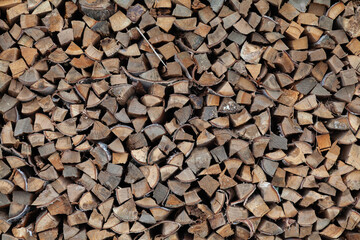 Wood with the preparation and stacking of firewood from chopped wood for kindling and heating the house.