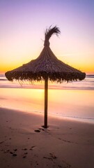 Beach umbrella at sunrise