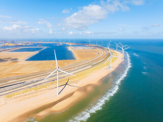 Wind turbine on the seashore. Renewable and natural energy sources. Green energy. Heavy industry. Drone view of wind generators. Waves and beach.