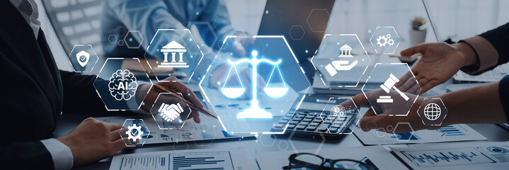 A collaborative business meeting displaying digital scales of justice, symbolizing the integration of technology within the legal profession. Trope