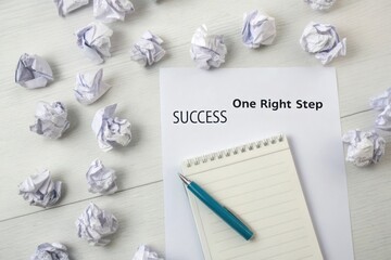 Crumpled paper around success message symbolizing persistence and effort