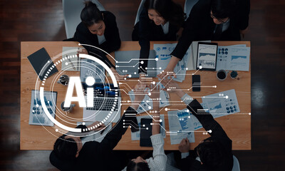 A diverse team of business professionals collaborates at a sleek table, engaging with digital analytics and AI technologies for strategic decision-making in a modern office. Trope