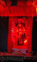 Idol of Goddess Devi Durga at a decorated puja pandal , Durga Puja is a famous and major religious traditional festival of Hinduism that is celebrated throughout the world.
