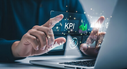 Businessman analyzing business performance data on a futuristic virtual interface with key performance indicator metrics and graphs.