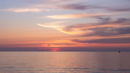 Naklejka premium Sunset Over Calm Ocean With Silhouette Sailboat clouds