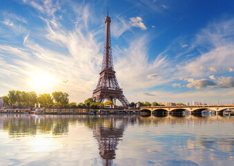 Fototapeta premium Eiffel Tower and the bridge with reflection in Seine river, Paris, France