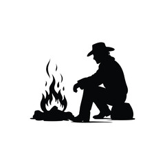 Cowboy silhouette sitting by a campfire in the wilderness