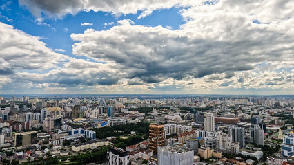A panorama of a large developing city with diverse architecture.