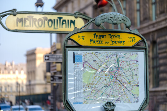 Paris, France - August 9,  2025 : View of the entrance of the Palais Royal - Louvre Museum Metro Subway station in Paris France and the metro map