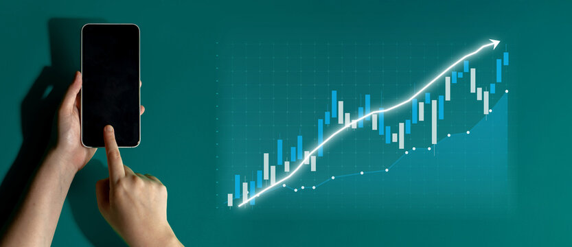 A hand interacts with a smartphone, showcasing financial data trends with charts and graphs on a green background, symbolizing modern business analysis. Impute - Powered by Adobe