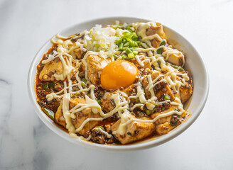 Spicy Mapo Tofu Donburi with Creamy Mayonnaise and Fresh Scallions in bowl on marble background top view Asian Cuisine
