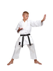 Young karate boy in white kimono