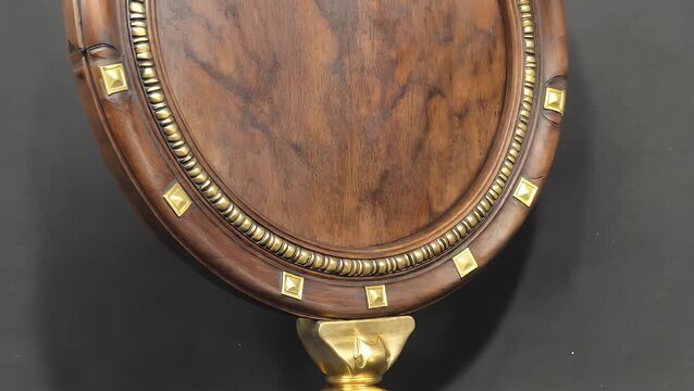 Antique Circular Wooden Photograph Frame Displayed from Frontal Perspective with Elaborate Carved Golden Square Embellishments and Empty Plinth