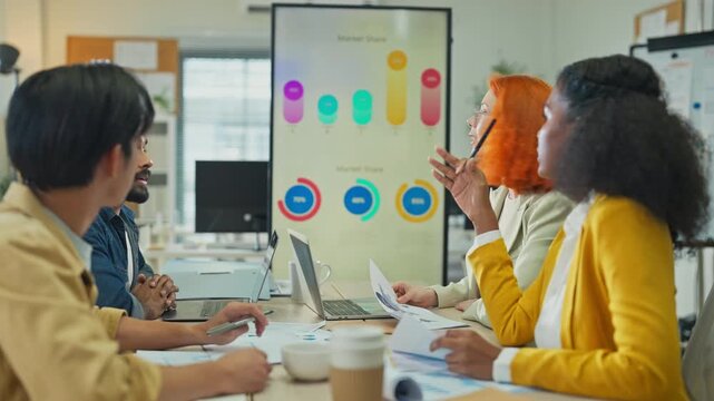 Diverse multiethnic fintech professionals collaborate in agile hackathon workshop, sharing adaptive business strategies through AI-powered big data analytics for exponential growth and convergent