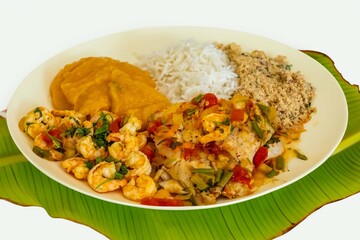 Brazilian moqueca capixaba is a typical dish from Espírito Santo, Brazil, with sea fish and shrimp, cooked in a clay pot and accompanied by white rice, pirão and farofa.