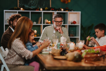 Family enjoying thanksgiving dinner together at home
