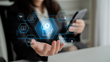 Head with gear and icons representing learning, digital training, and development process, showing...